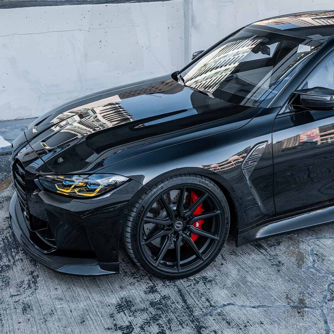 Front view of black G80 M3 with Carbon Fiber Side Skirt and Front Splitter by RSC
